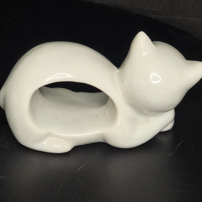 Side view of vintage animal napkin ring set showing three-dimensional sculpting