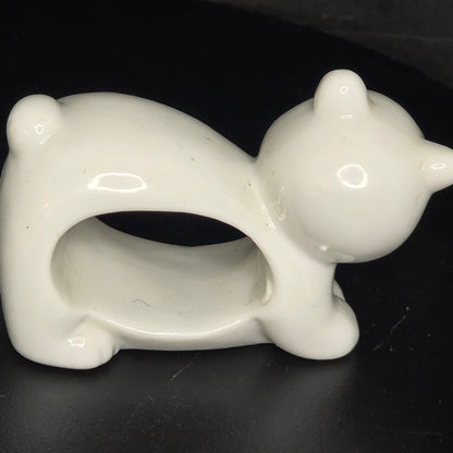 Side view of vintage animal napkin ring set showing three-dimensional sculpting