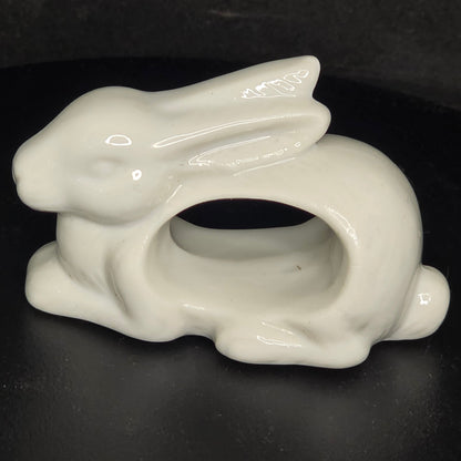 Close-up of vintage Japan porcelain bunny napkin ring showing cream glazed finish