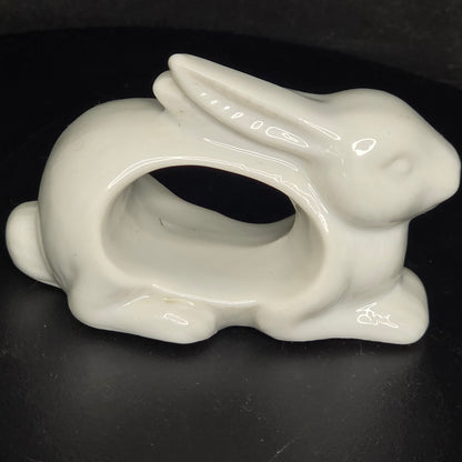 Side view of vintage animal napkin ring set showing three-dimensional sculpting