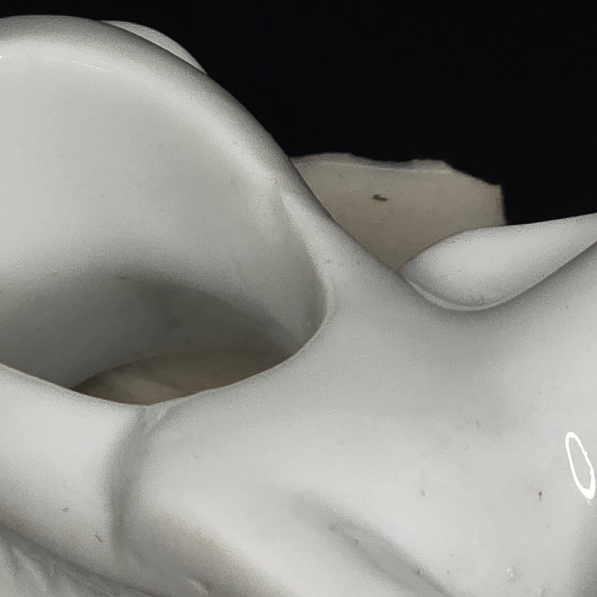 Close-up of porcelain puppy napkin ring