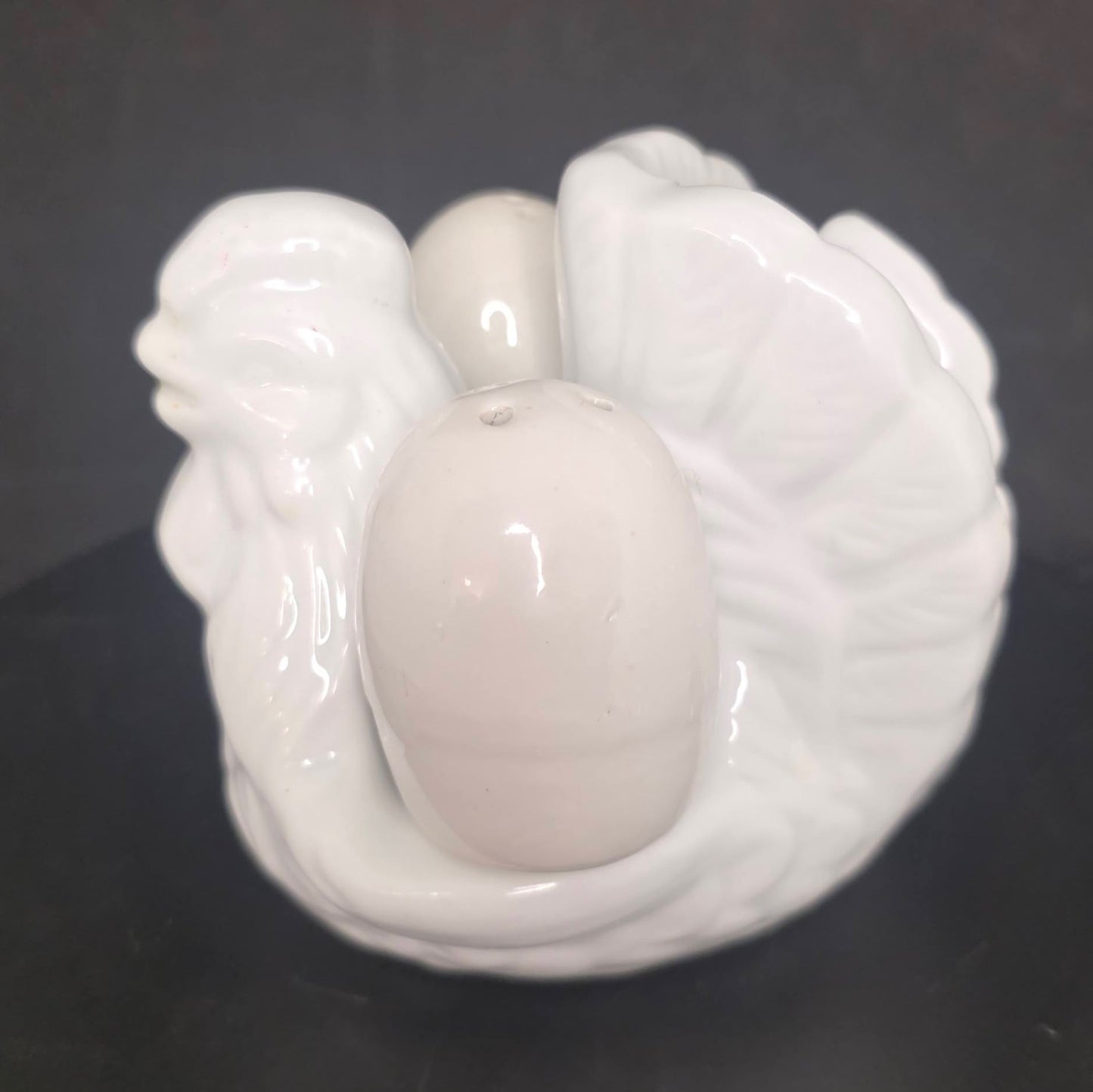 Side view of vintage chicken napkin holder, 4 inches tall