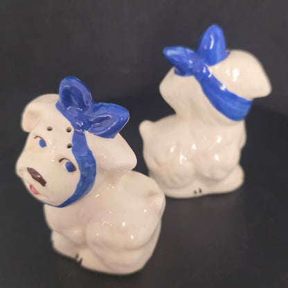 Front and back view of vintage Mugsy dog shakers in excellent condition