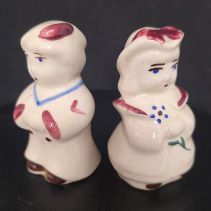 Front view of vintage nursery rhyme character shakers, circa 1940s-1950s