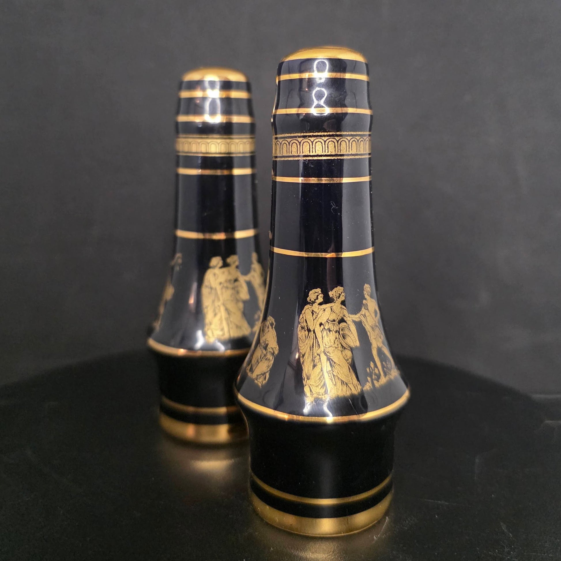 Side view of Neofitou black and gold shakers in excellent condition