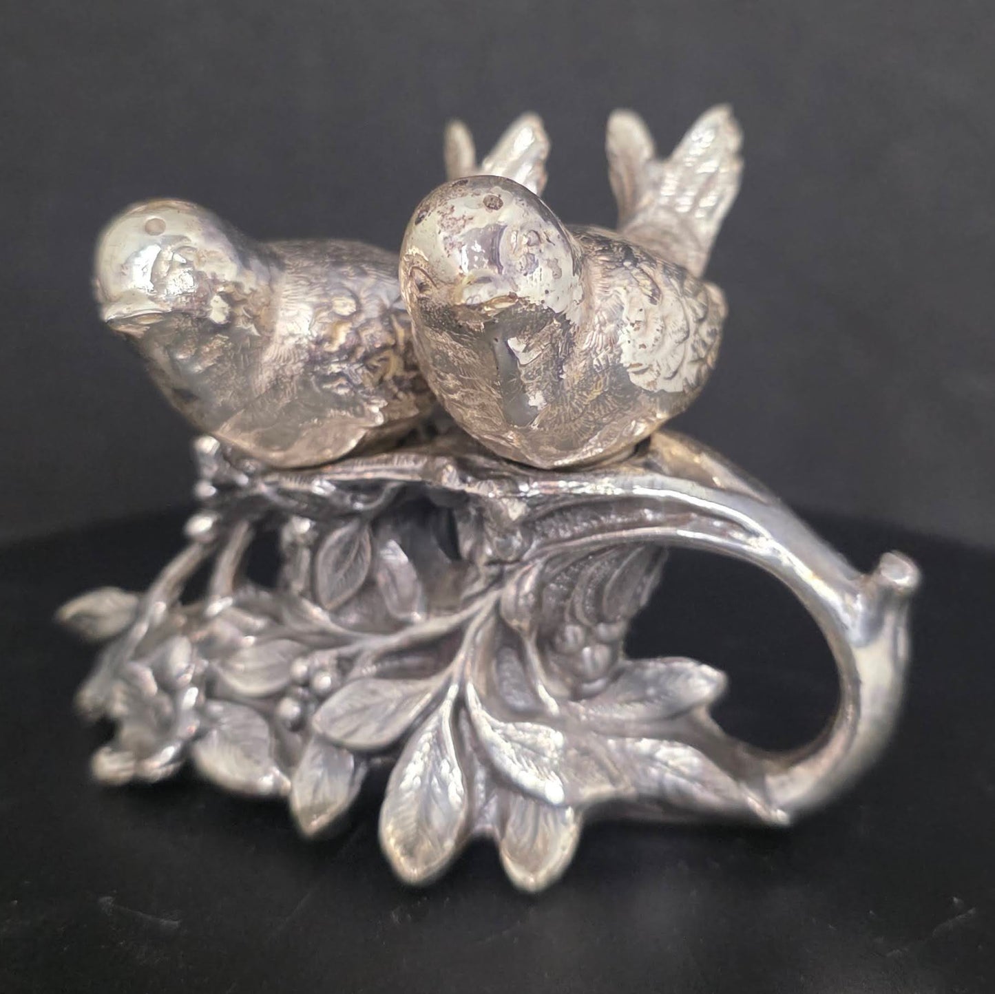 Front view of vintage silverplate lovebird shakers, circa 1920s-1940s