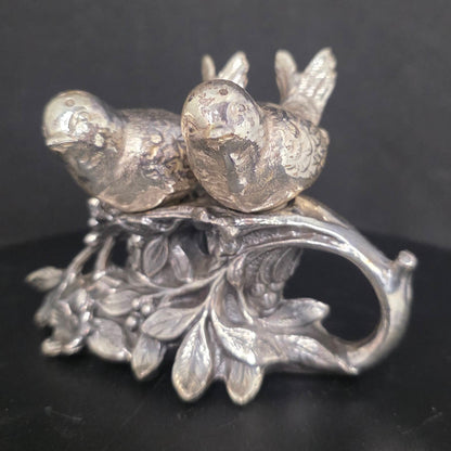 Front view of vintage silverplate lovebird shakers, circa 1920s-1940s