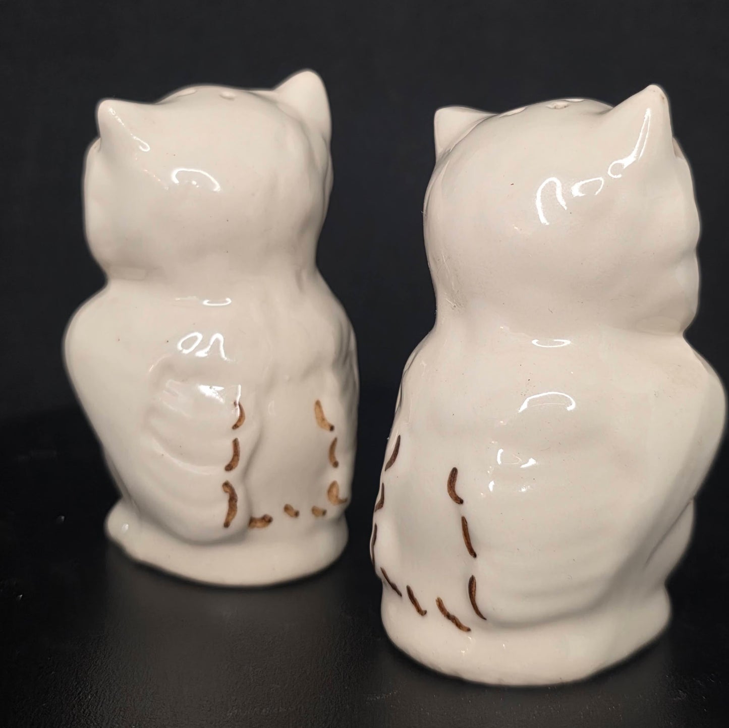 Back view of winking owl shakers, 3.25 inches tall, no stoppers