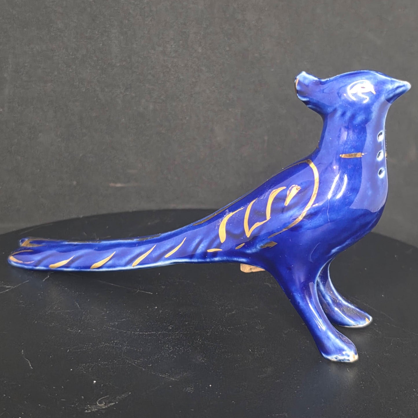 Side view of cobalt blue pheasant shaker, possibly made in Russia