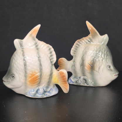 Front view of glazed ceramic angel fish shakers with stoppers