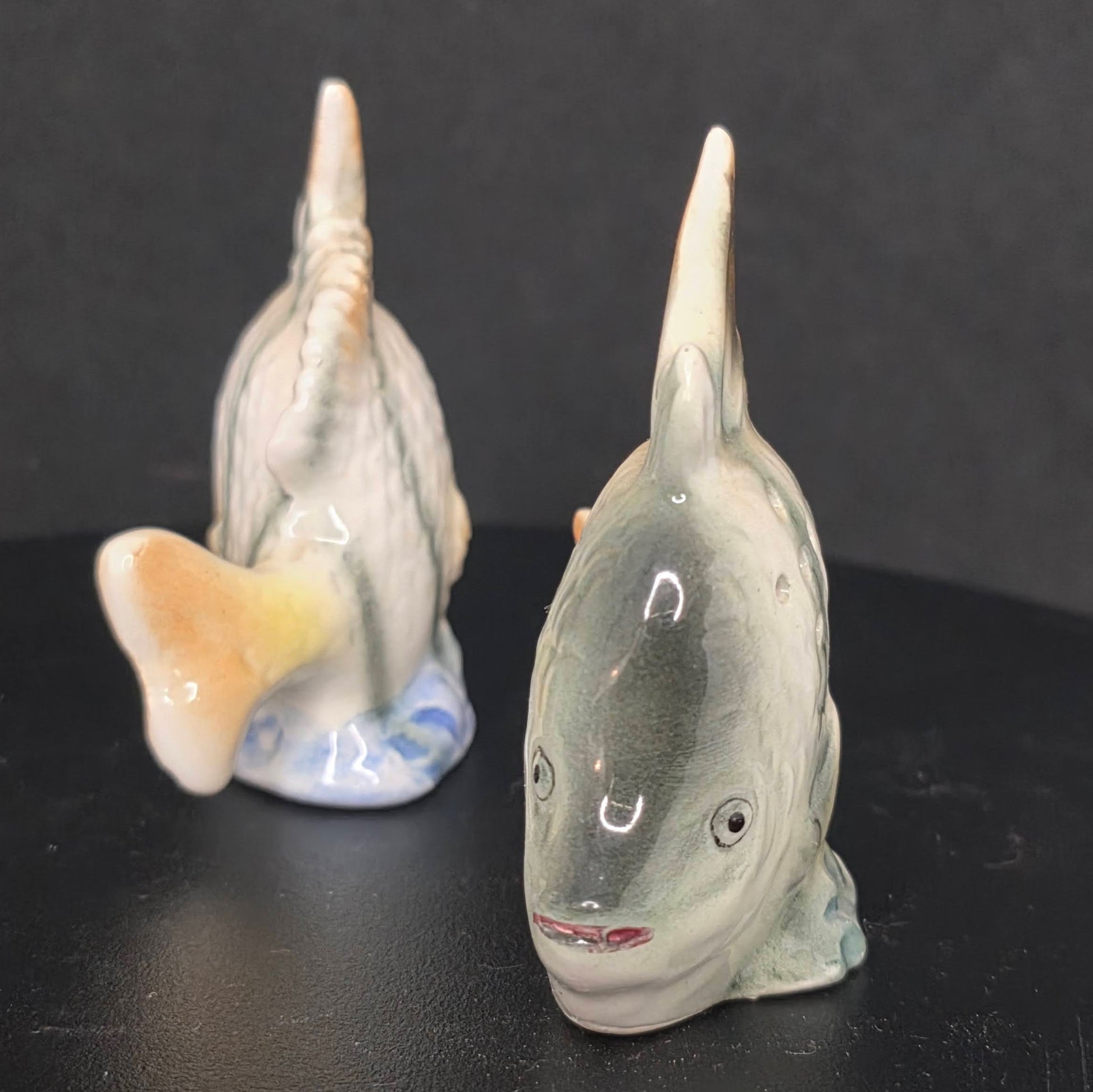 Side view of vintage Japanese angel fish shakers in excellent condition