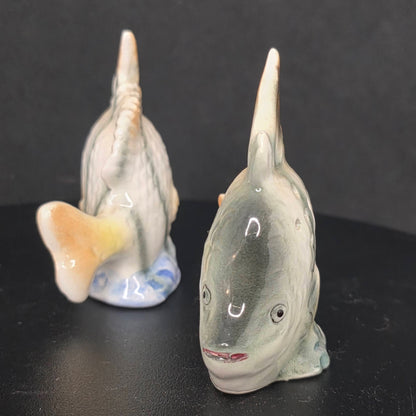Side view of vintage Japanese angel fish shakers in excellent condition