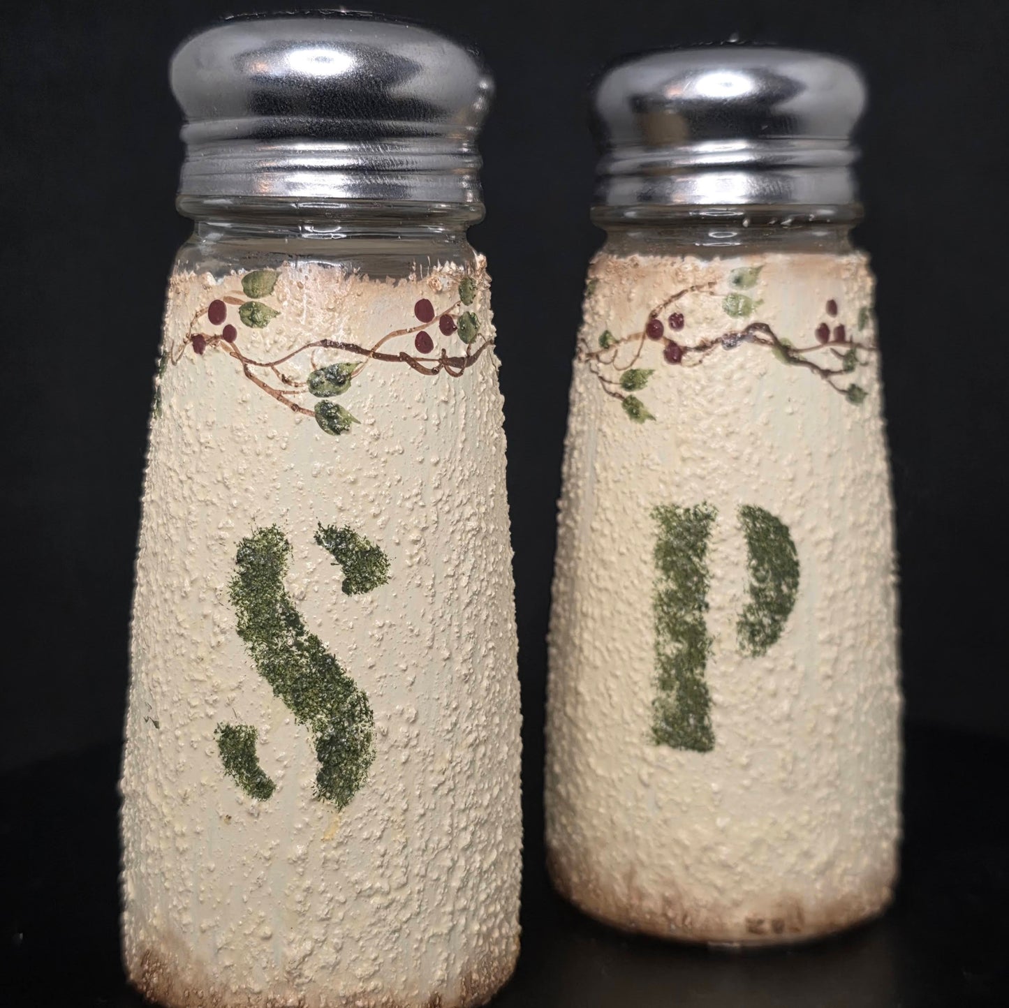 Back view of snowman shakers showing metal lid construction