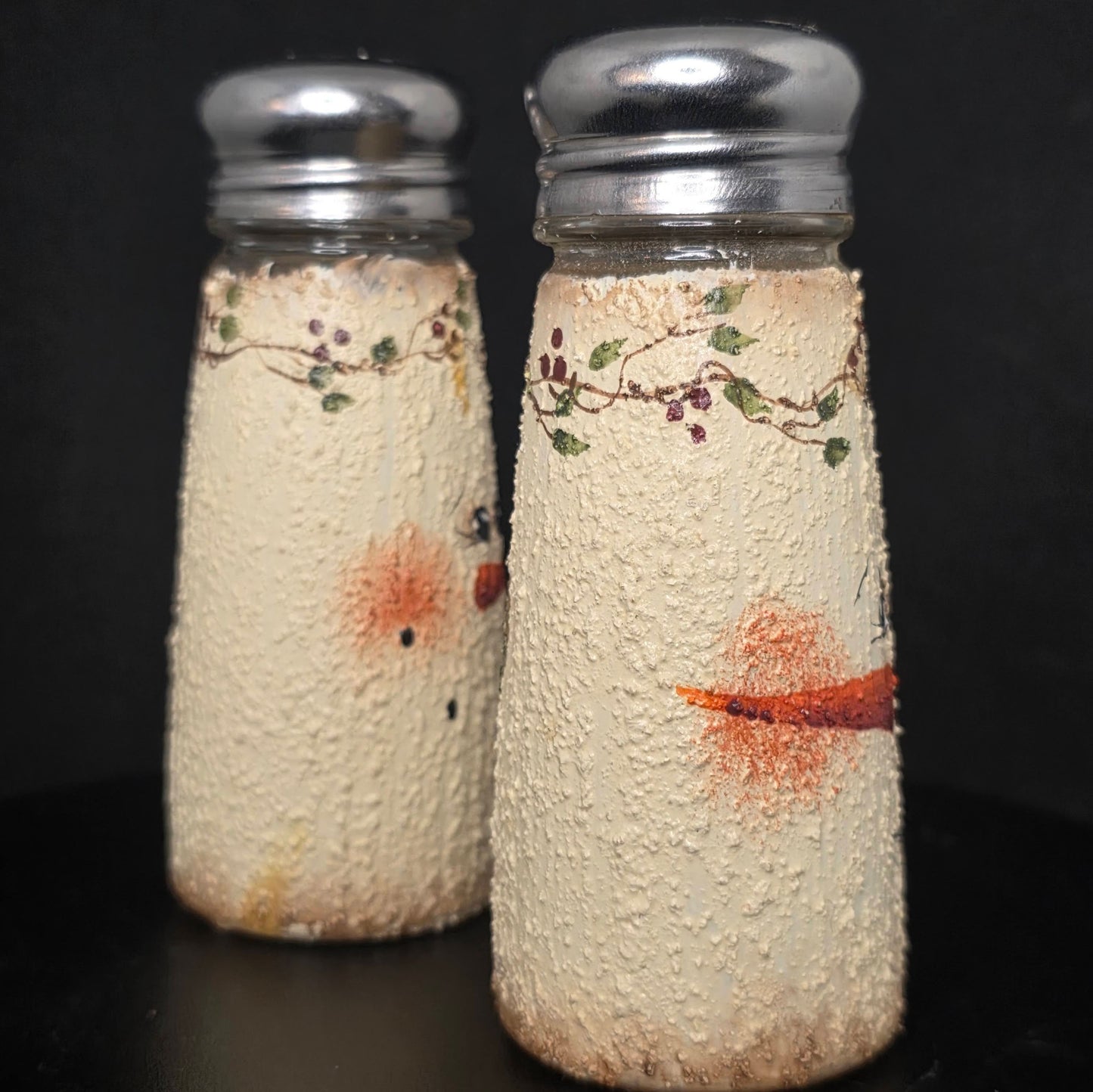 Side view of vintage snowman salt and pepper shakers, circa 1990s-2000s