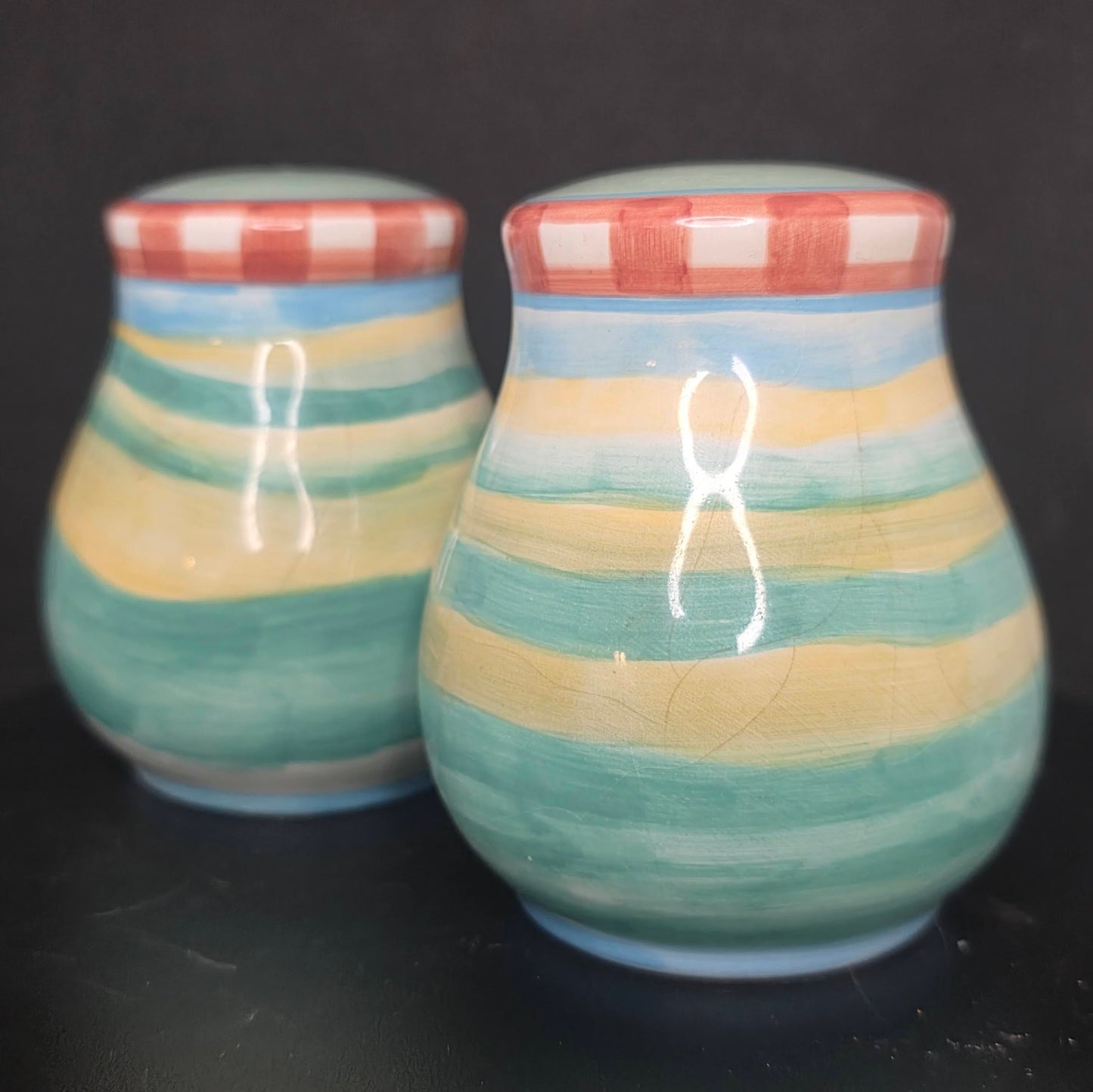 Back view of cow and rooster shakers in excellent condition, 3.5 inches tall