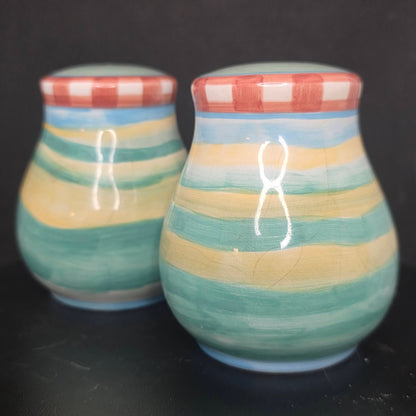 Back view of cow and rooster shakers in excellent condition, 3.5 inches tall