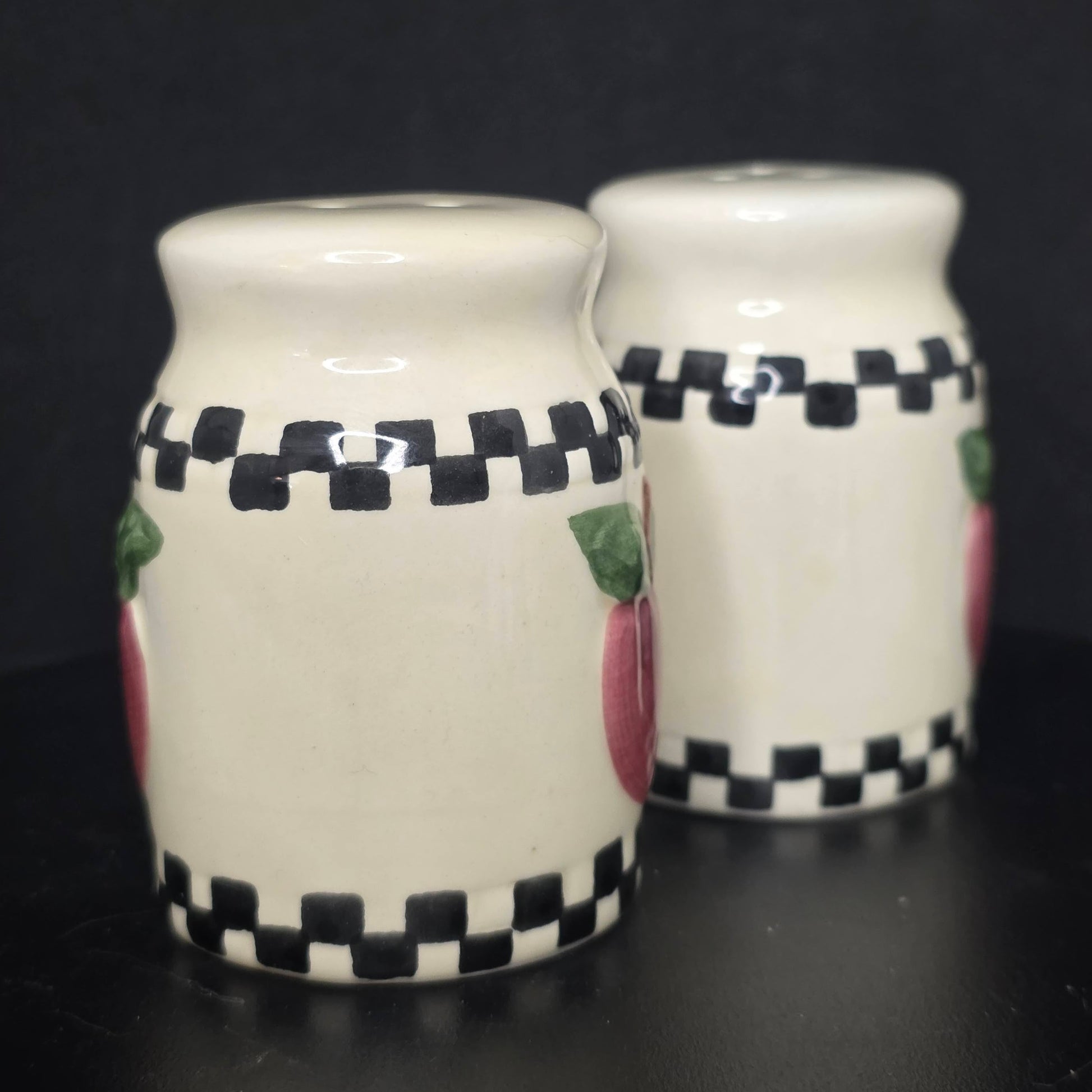 Side view of country apple milk can shakers showing checkerboard detail