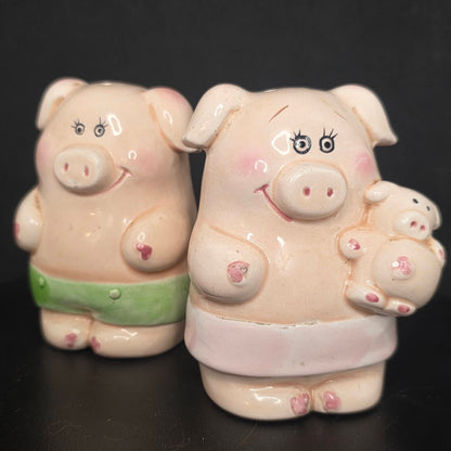 Vintage boy and girl with baby pigs salt and pepper shakers, circa 1960s