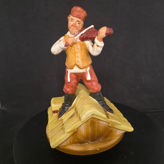 Close-up of vintage Fiddler on the Roof theater memorabilia figurine showing hand-painted details