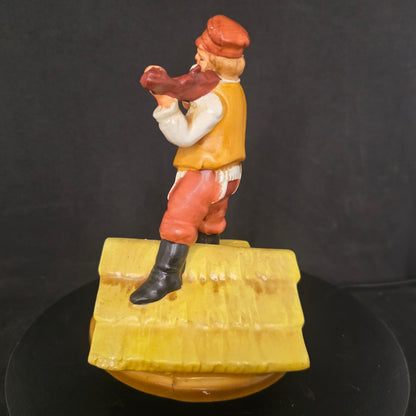 Side view of 1960s Broadway collectible musical figurine plays If I Were a Rich Man