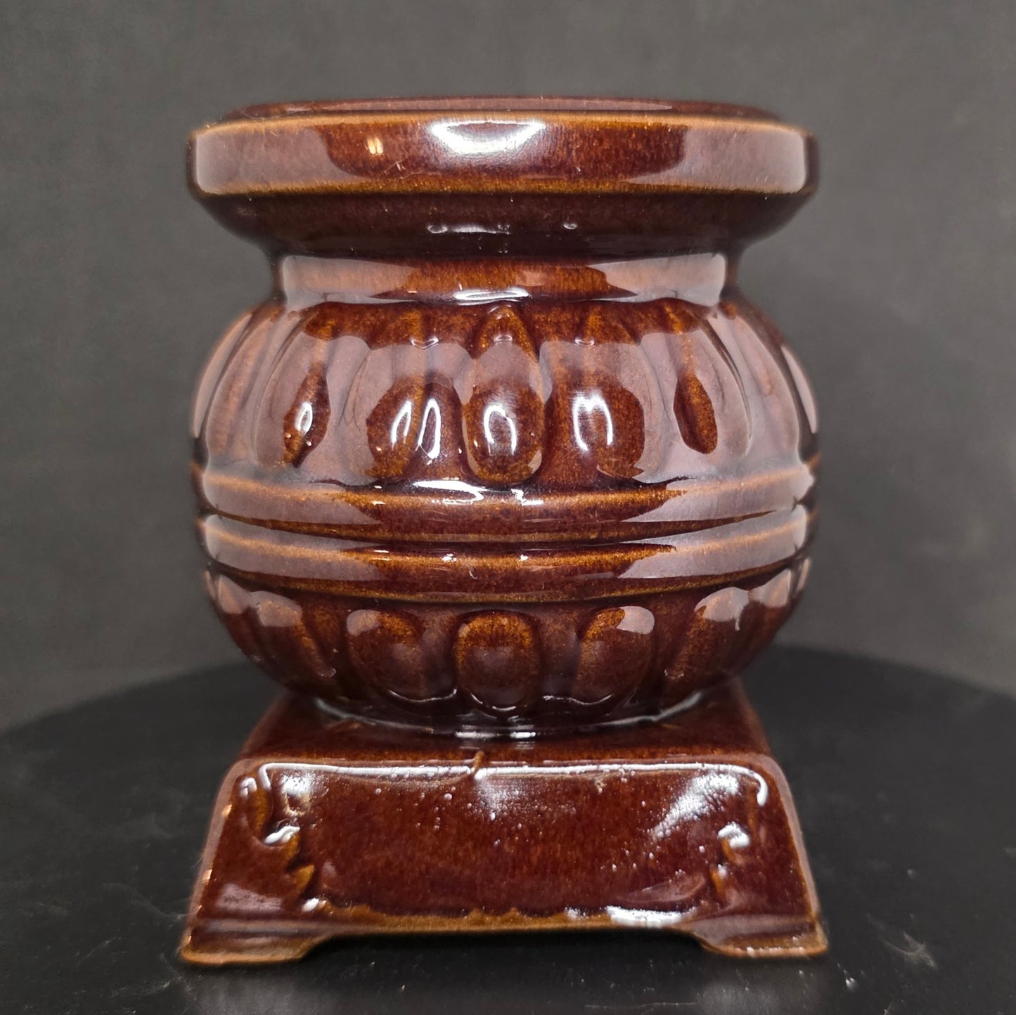 Back view of vintage Inarco ceramic pot belly stove kitchen decor showing rustic details