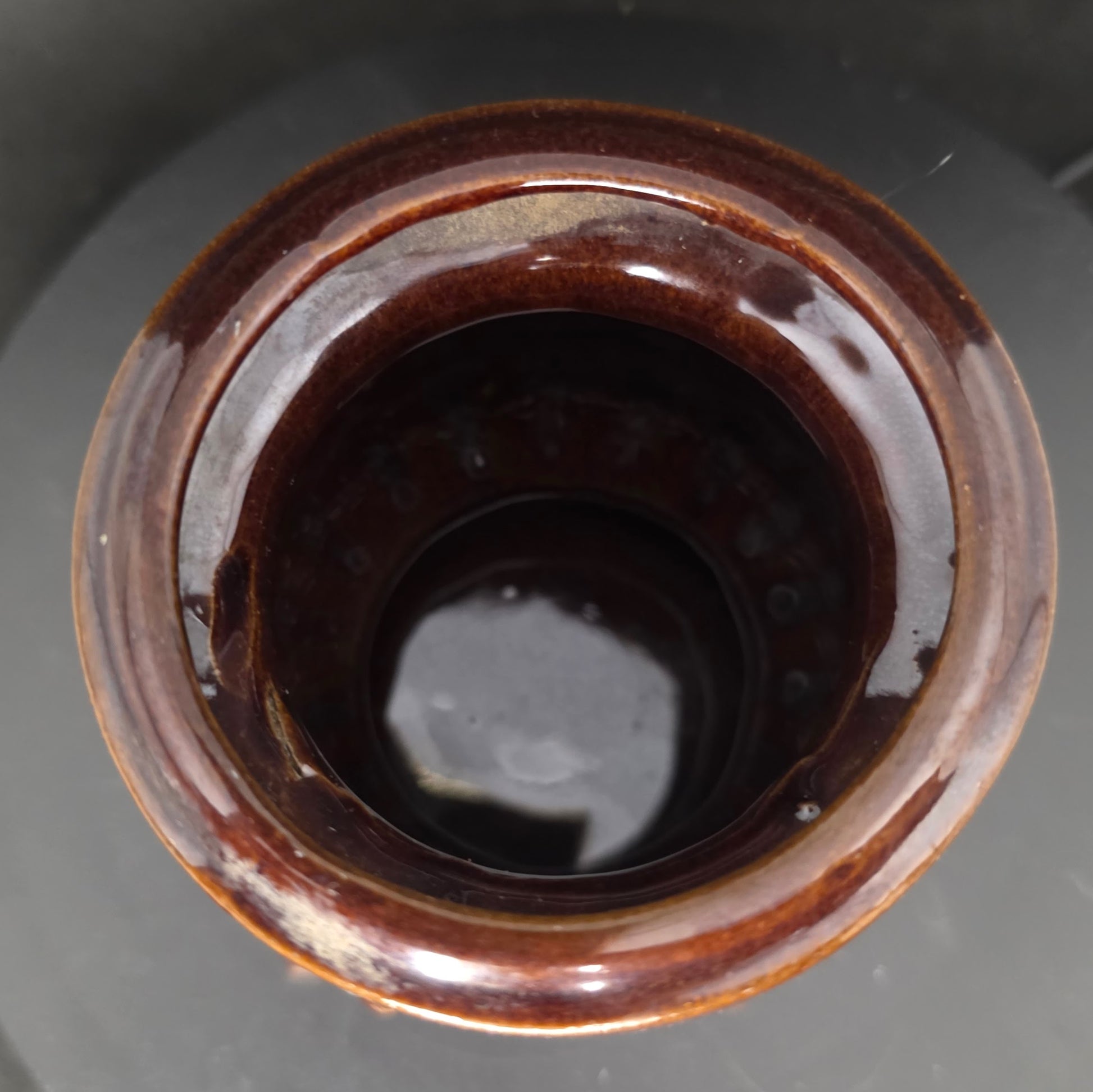 Interior view of 1960s Inarco Japan pot belly stove utensil holder in brown ceramic