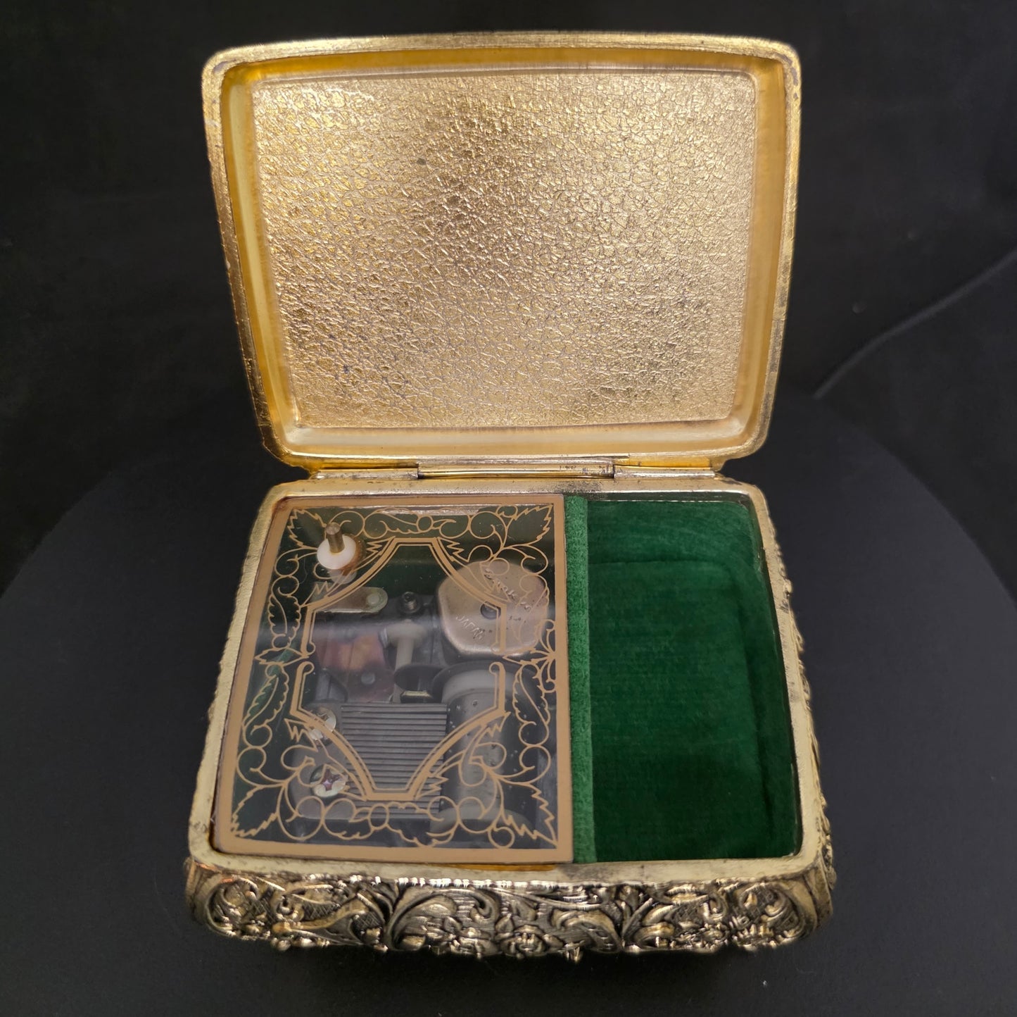 Interior of vintage Sankyo music box showing brass construction and mechanism