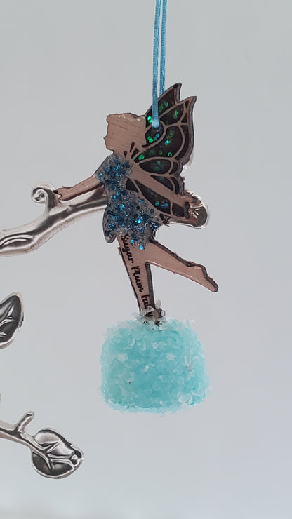 Decorative ornament with a fairy design and blue element on a light white background